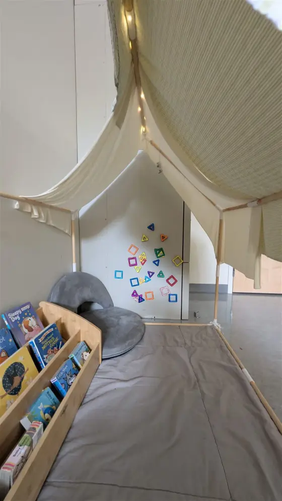 A cozy reading nook in the Caterpillar Room